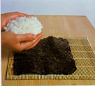 Preparing the nori with seasoned rice