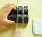 Cutting the maki sushi